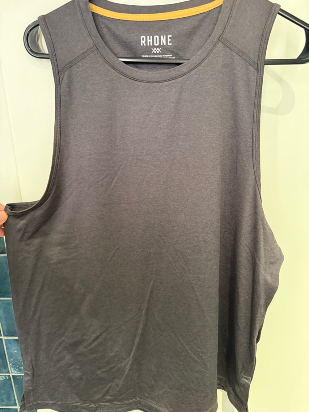 RHONE Charcoal Sleeveless Athletic Tank with Gold Trim